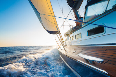 Sailboat navigating into the horizon